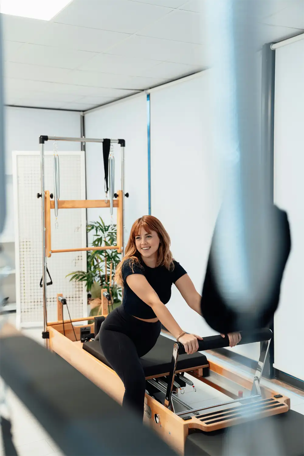 Hypermobility-HSD Smiling woman stretching.